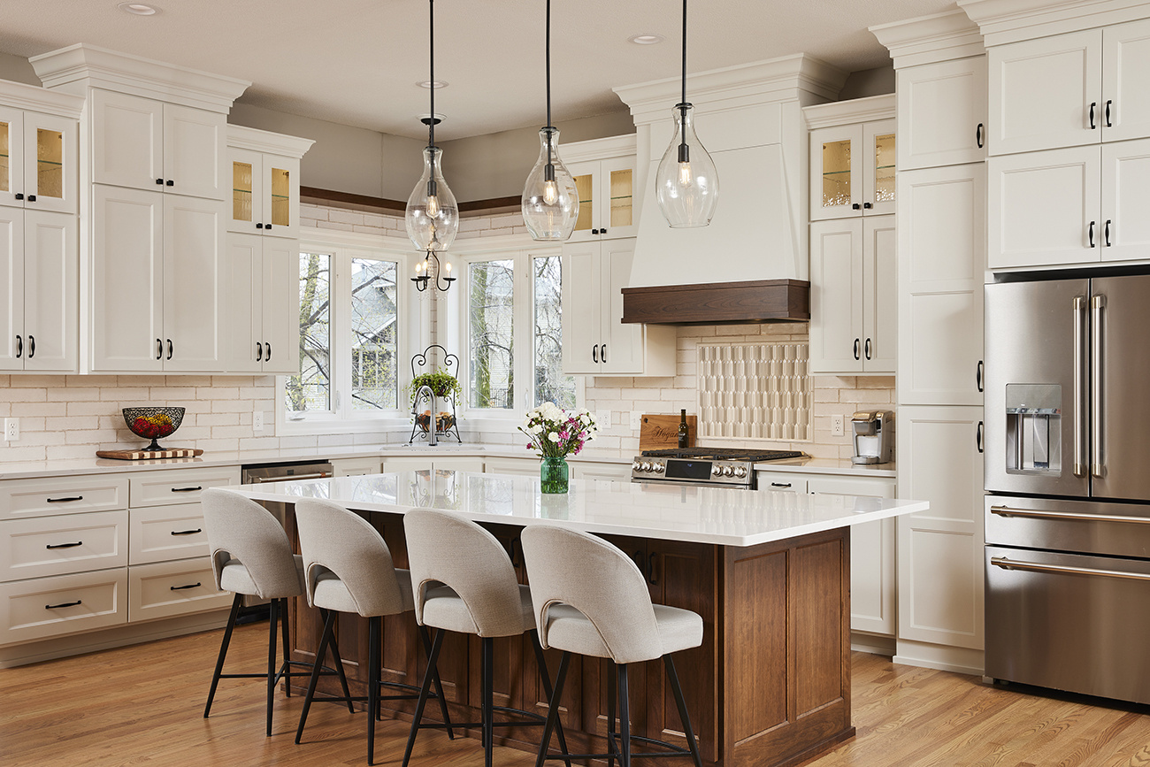 Enameled kitchen treatment, island and perimeter cabinets in a soft white.